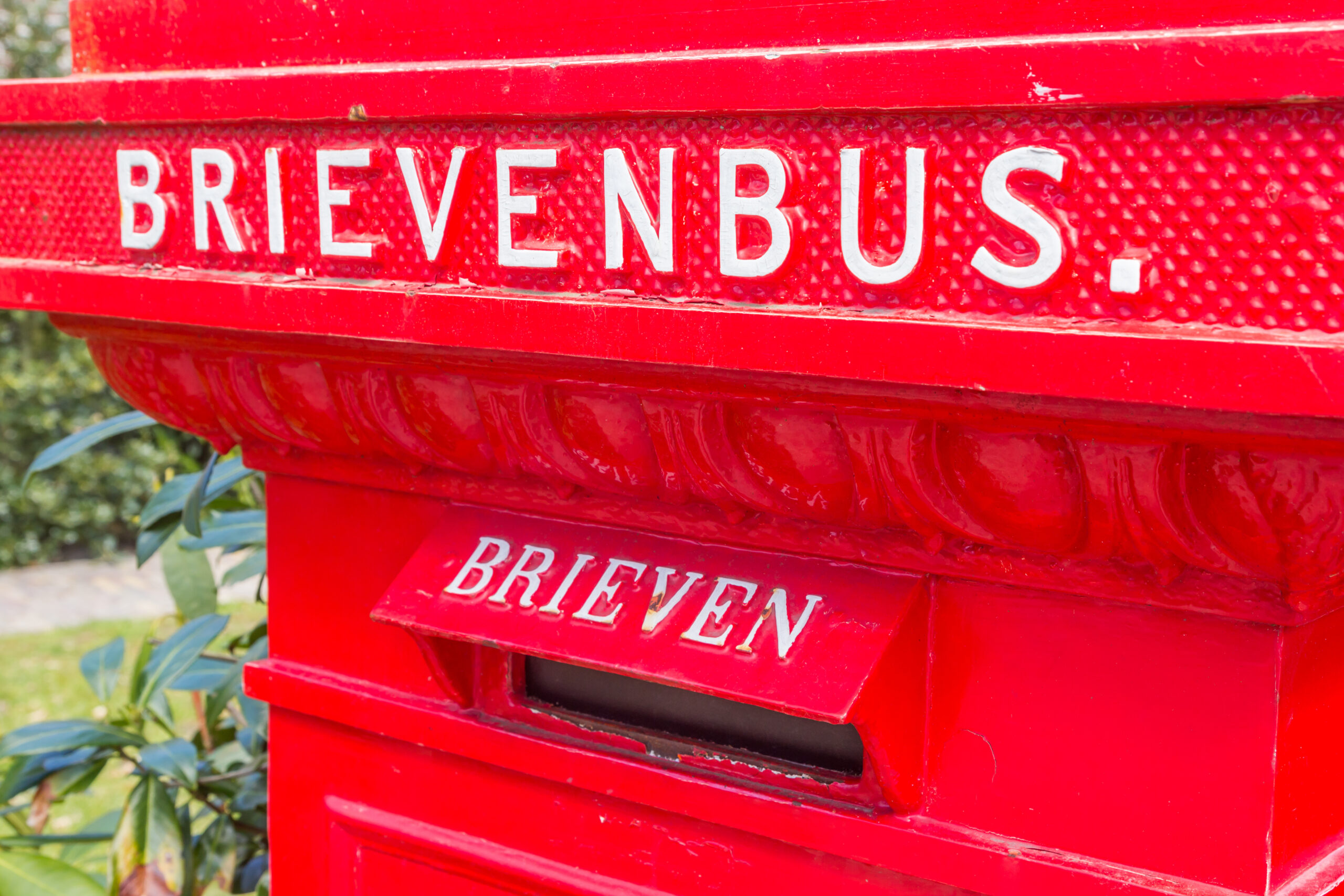 Retro style red mail box in historic village Orvelte, Netherlands